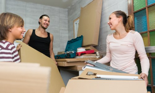 Removal team sorting reusable items and recyclable materials during a Hackney move