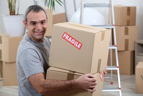Removal team handling boxes in Hackney during a house move