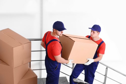 Professional movers handling furniture carefully