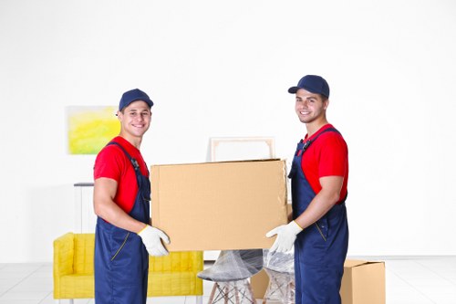 Removal company team handling a move in Hackney with boxes and furniture
