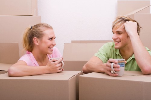 Removal company pricing discussion with packed moving items in Hackney