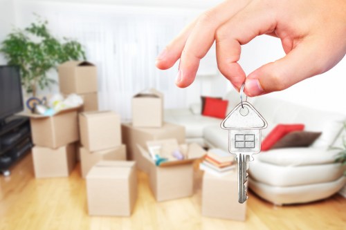 Removal van and moving crew handling a residential move in Hackney