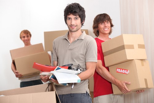 Customer support team assessing a removal complaint on paperwork