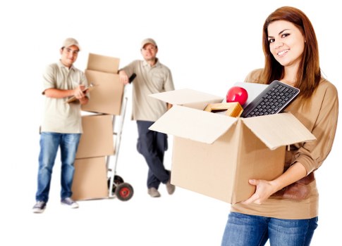 Worker using safe lifting technique during removals