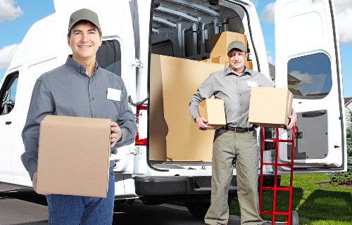 Organised removal van loading with safety-focused moving team