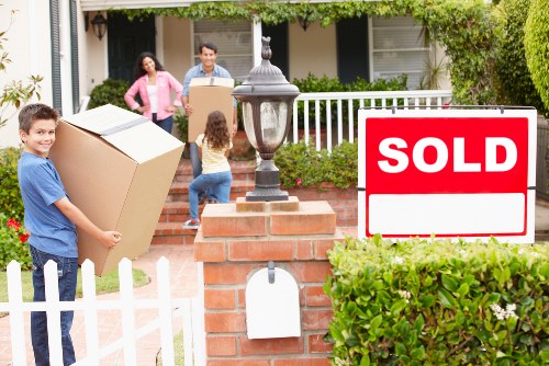 Careful unloading of boxes and furniture at a Hackney home