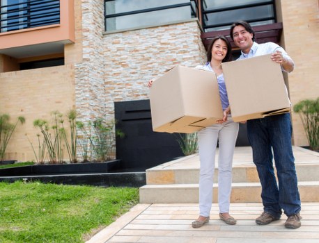 Staff using protective packing materials during a removal job